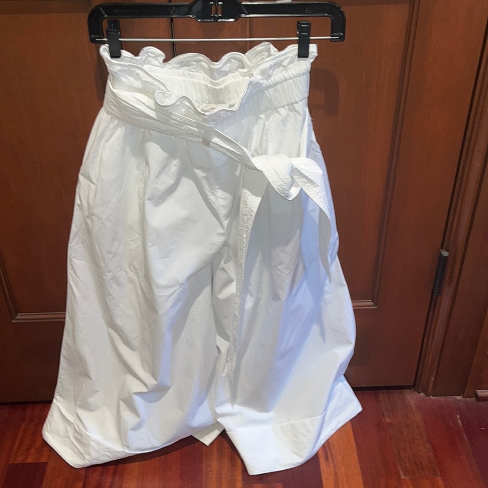 White pants. Size S. Perfect condition. Tie on waist. Ruffled top. Pockets